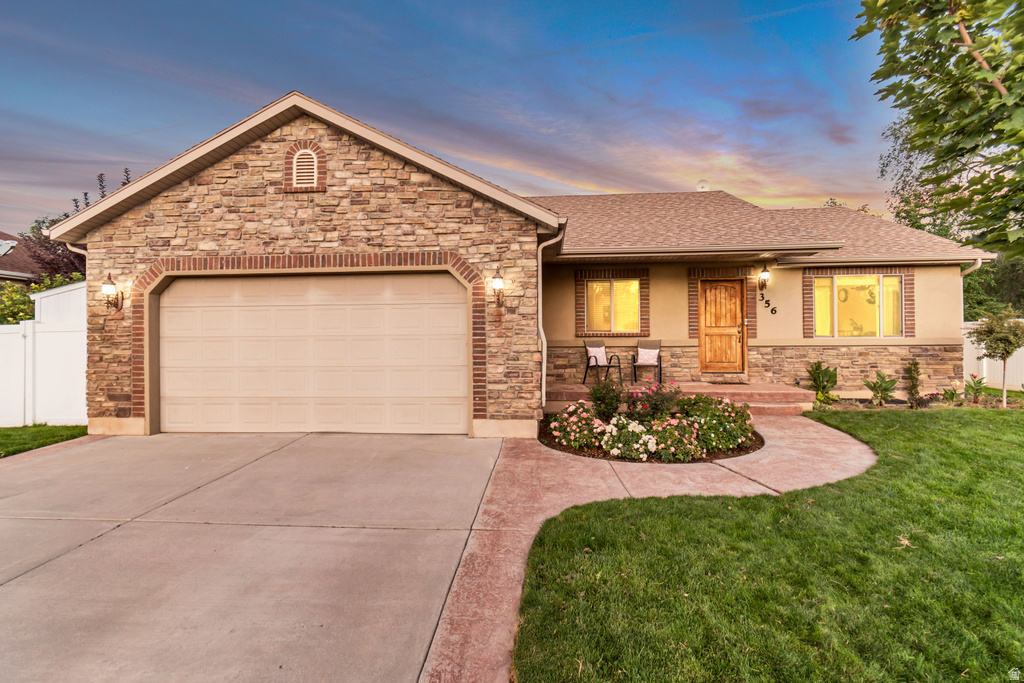 Stone and stucco exterior with brick accents