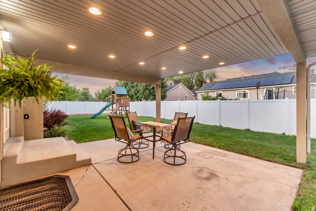 Covered patio with recessed lighting and concrete flooring