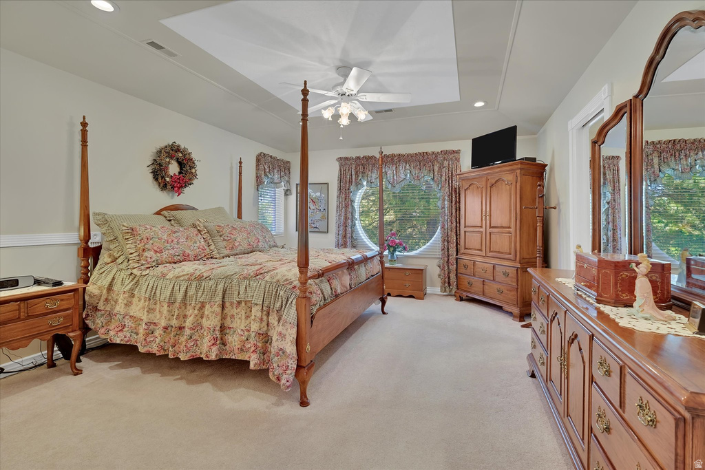 Recessed ceiling detail with a central ceiling fan and lighting