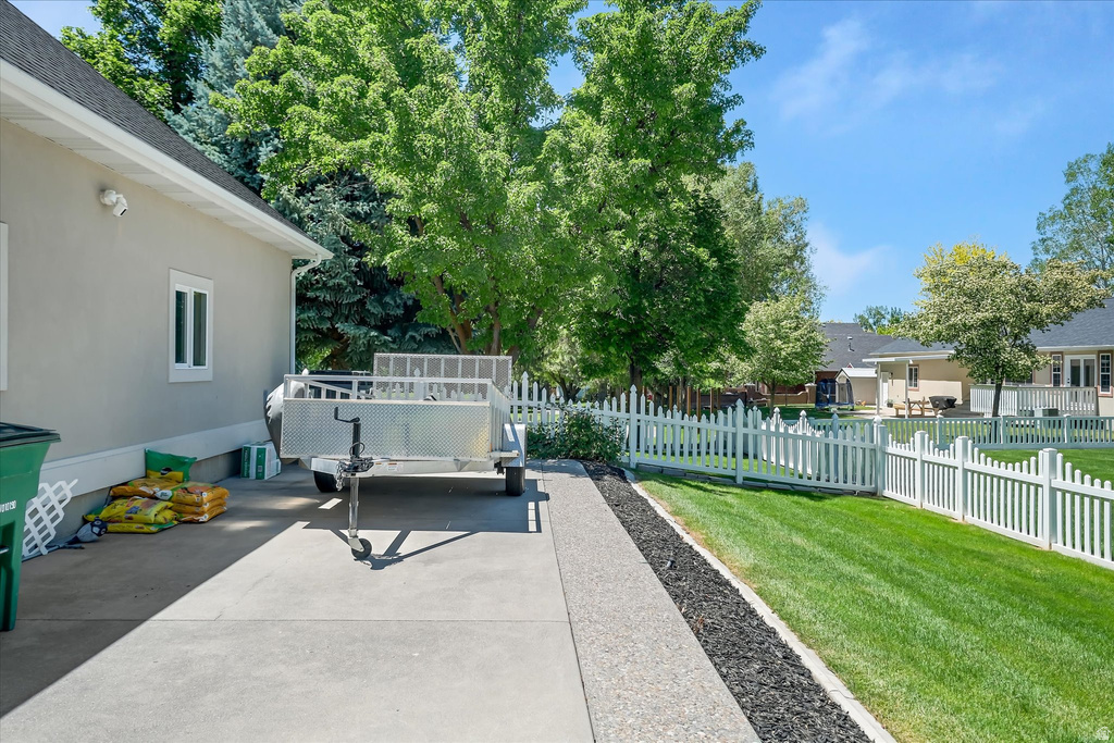 Concrete driveway extending along the property side
