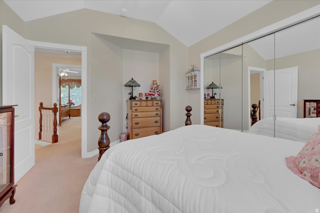 Bedroom featuring vaulted ceilings and neutral wall tones