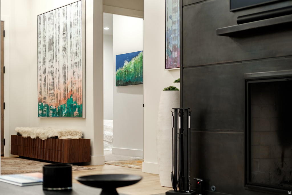 Modern fireplace surround with a dark finish, integrated mantel, and hearth