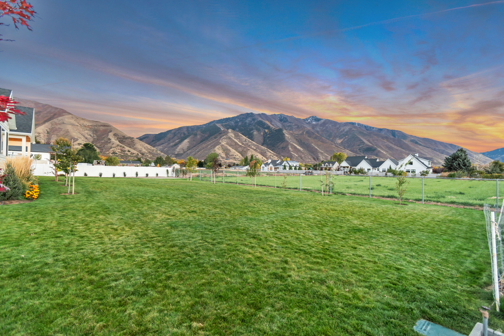 Expansive green lawn with mountain backdrop