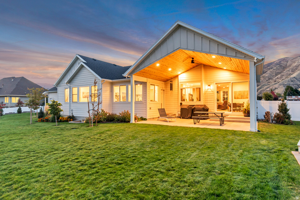 Expansive rear yard featuring a covered patio with recessed lighting and a wood-finish ceiling