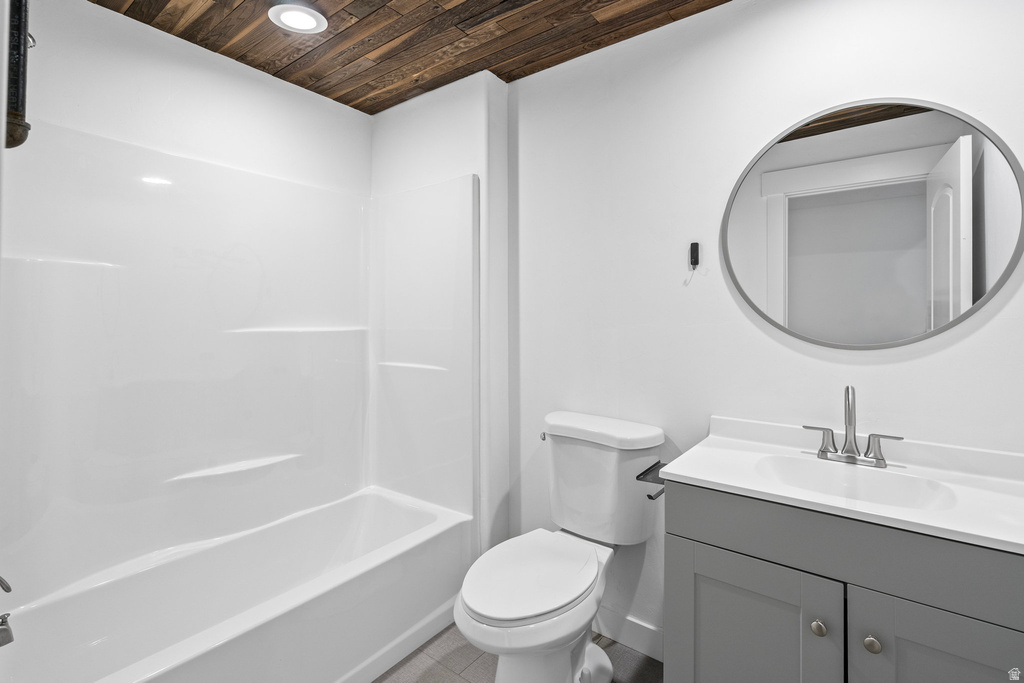 Bathroom featuring a wood-finish ceiling, white walls, and a white tub with shower surround