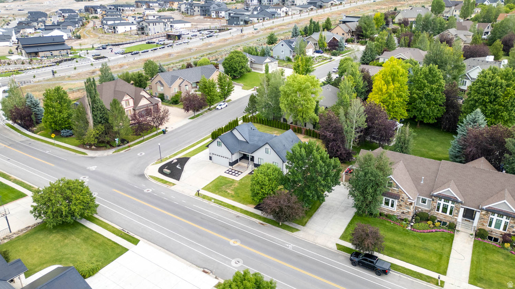 Single-story residence featuring a dark gray exterior, white trim, and a prominent two-car garage