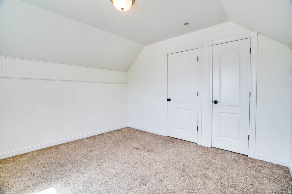 Neutral-toned carpet flooring complementing bright white walls