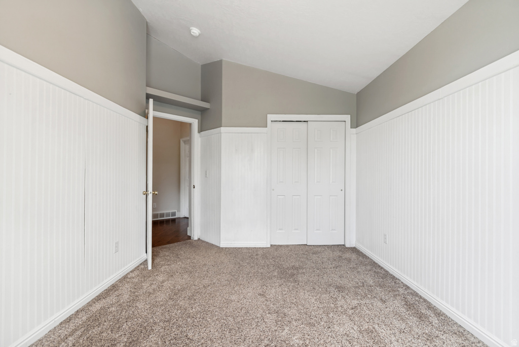 Neutral wall paint with textured white wainscoting and coordinating trim