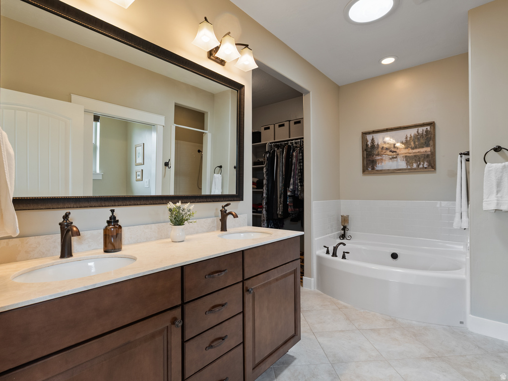 Dual vanity with undermount sinks, bronze hardware, and a framed mirror