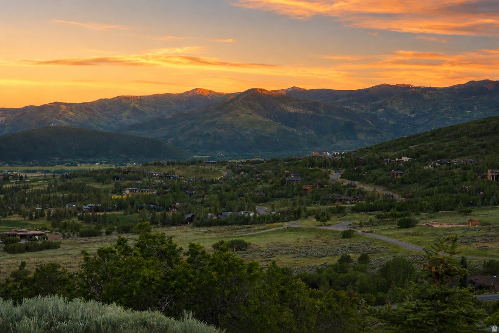 Mountain landscape featuring expansive green valleys and distant peaks
