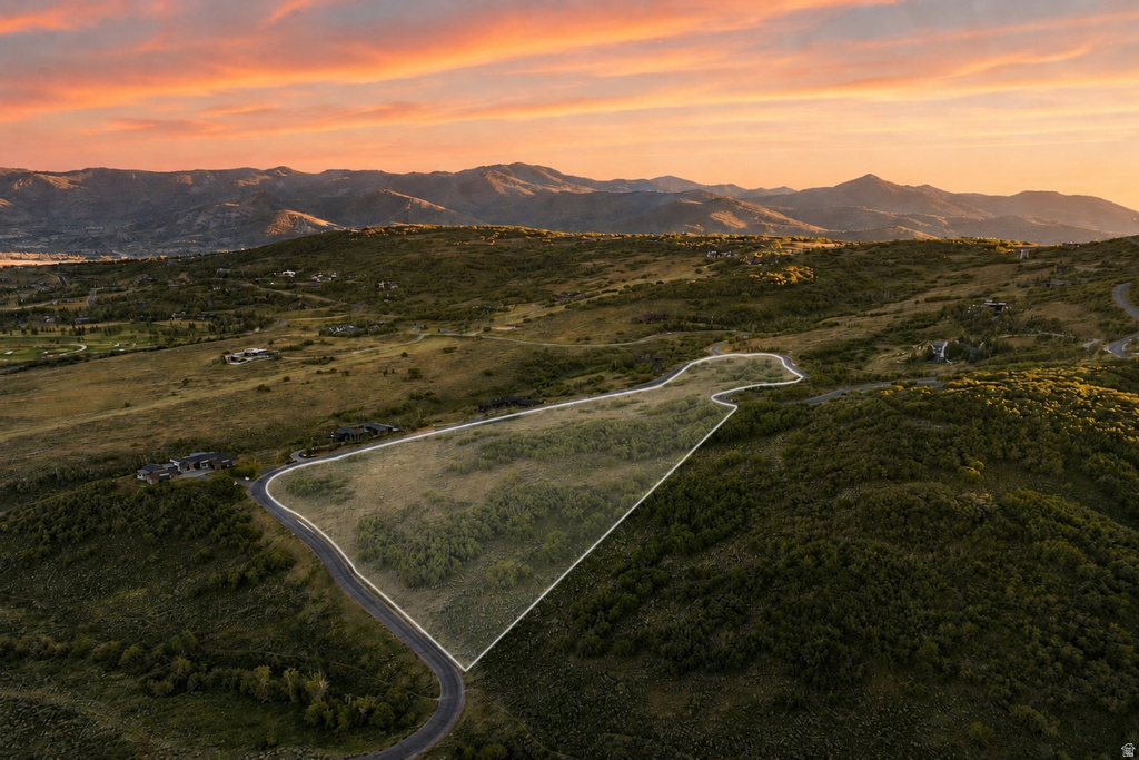 Expansive undeveloped parcel outlined by a white border, featuring natural terrain