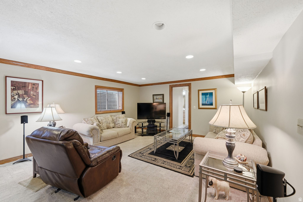 Spacious recreation room featuring recessed lighting, a window with blinds, and wood-finish trimwork