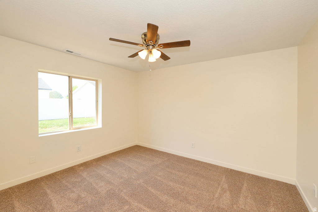 Neutral-toned walls and plush carpet flooring