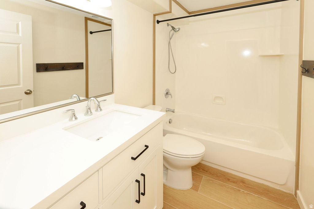 Contemporary bathroom featuring a white vanity with integrated sink, chrome faucet, and matte black hardware
