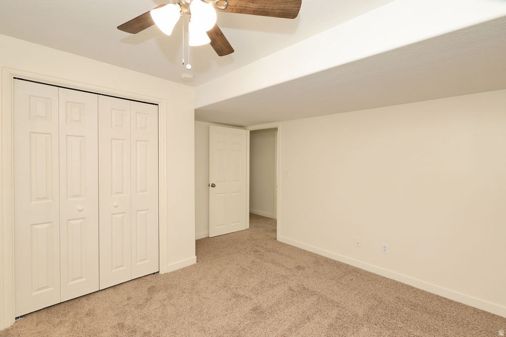 Interior room featuring neutral-toned carpeting and light-colored walls