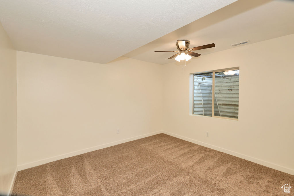 Room featuring neutral wall finishes and plush carpeting