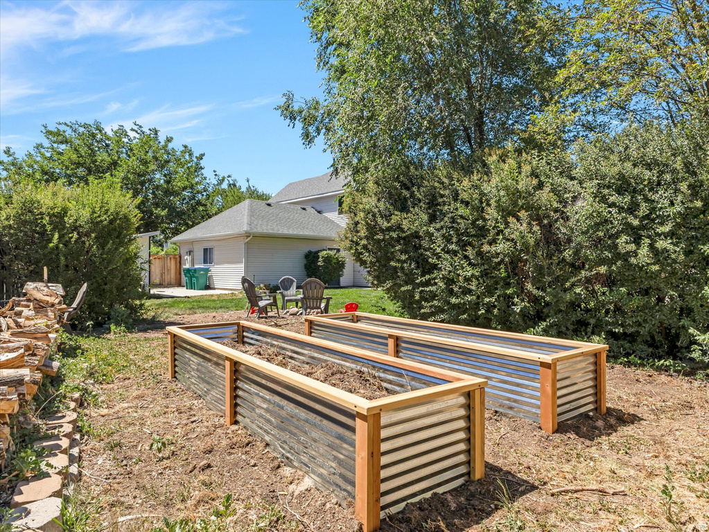Two raised garden beds featuring corrugated metal and wood framing