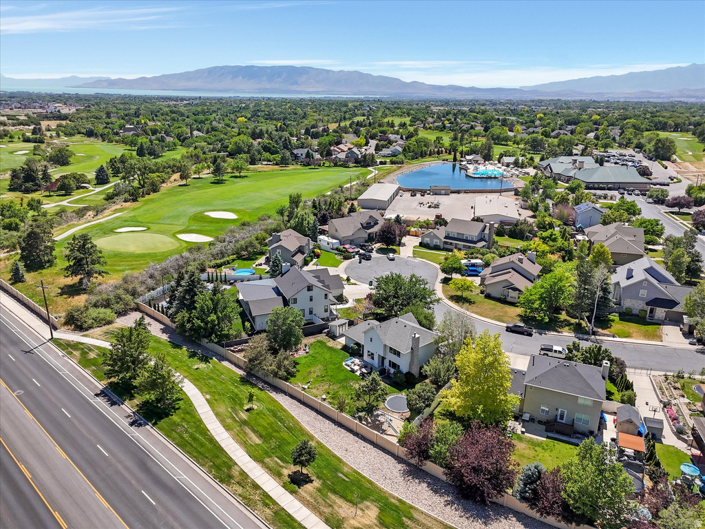 Expansive neighborhood featuring mature trees, residential properties, and a prominent golf course