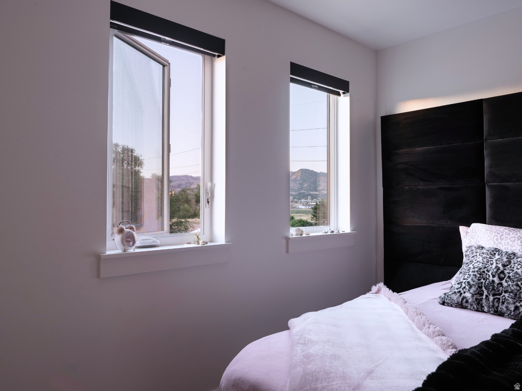 Dual casement windows with white trim and sills