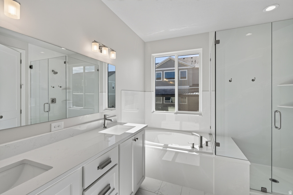 Double vanity with undermount sinks and light-colored countertops