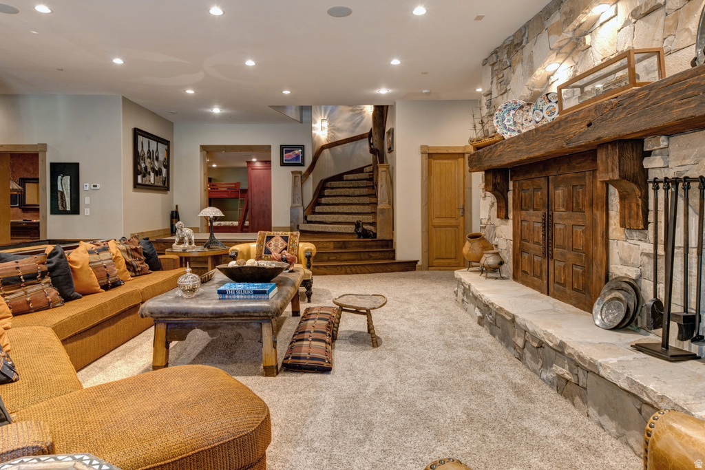 Stone fireplace with a substantial timber mantel and hearth