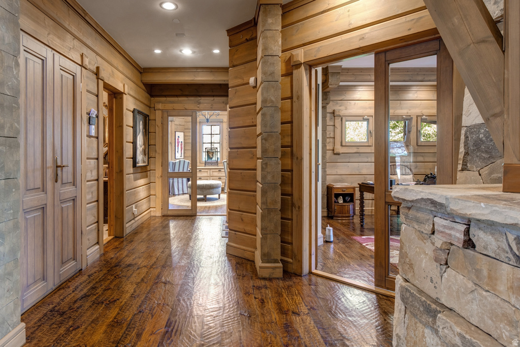 Rustic interior hallway featuring rich wood-finish flooring