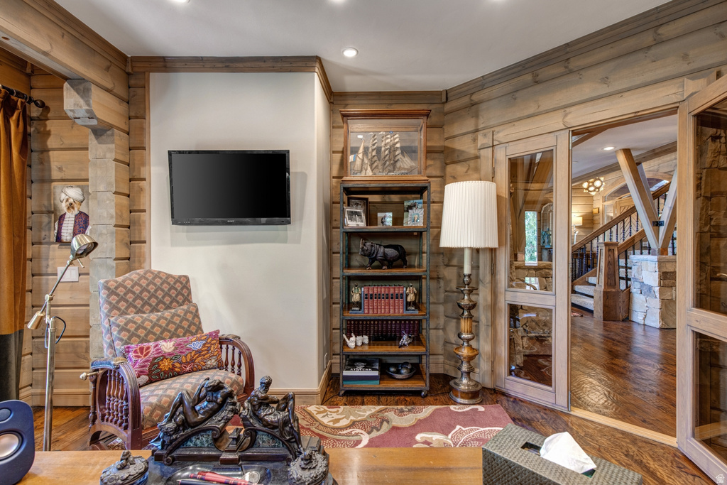 Paneled wood walls featuring integrated shelving