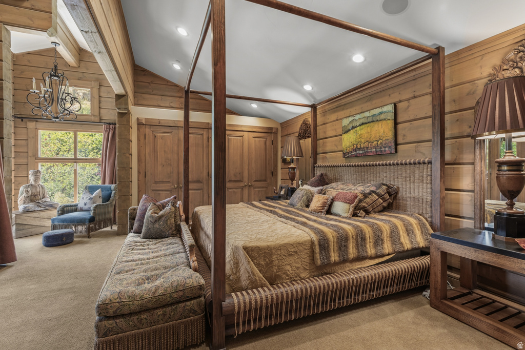 Wood-paneled room with exposed beams and a vaulted ceiling