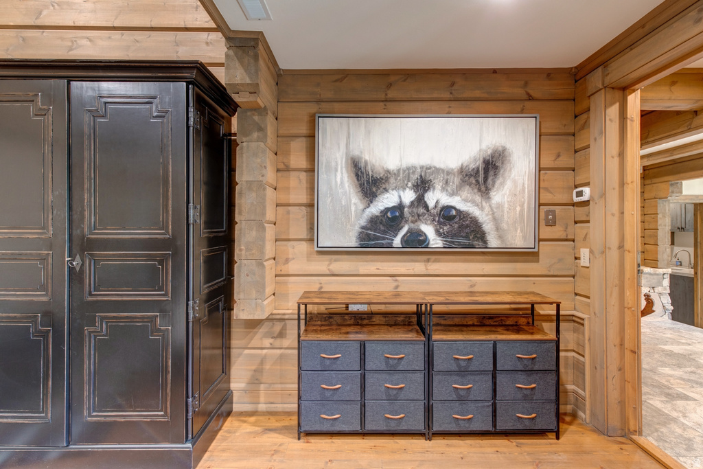 Natural wood-finish walls and flooring complement the rustic aesthetic
