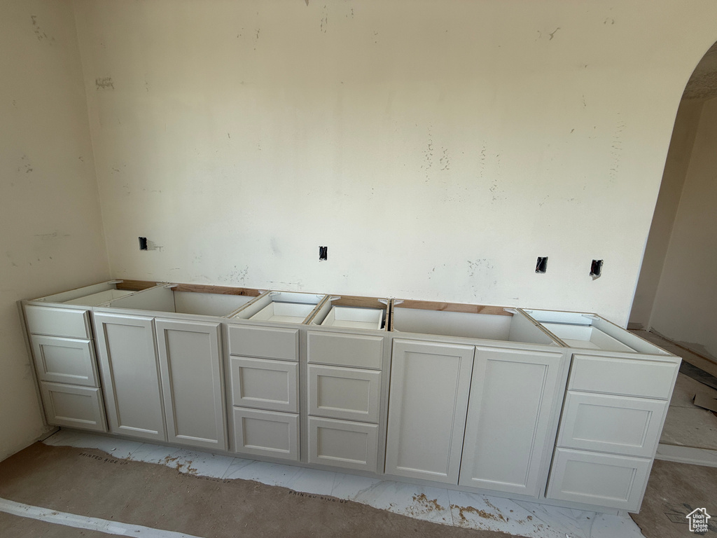 Custom cabinetry installation featuring shaker-style raised-panel doors and drawers with professional-grade hardware, positioned along the kitchen perimeter