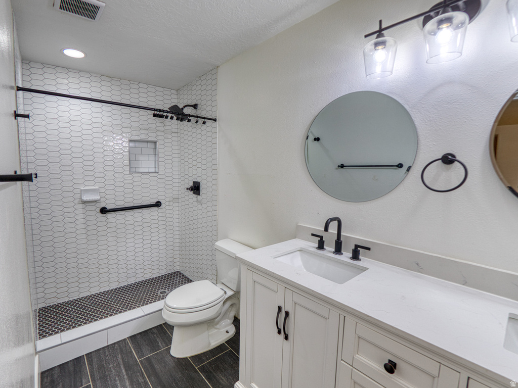 Contemporary bathroom featuring a large shower with white picket tile walls and black hexagonal floor tile
