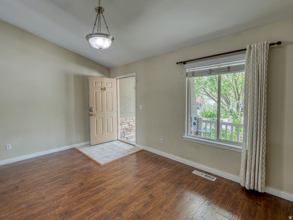 Entryway featuring wood-finish flooring and a neutral color palette