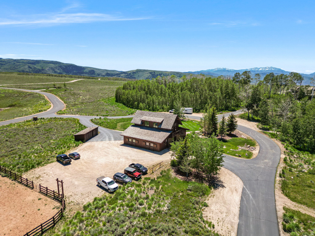 Mountain contemporary residence featuring a multi-level design and a natural wood exterior