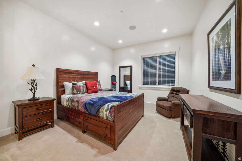 Bedroom featuring a single window with blinds, recessed lighting, and carpet flooring