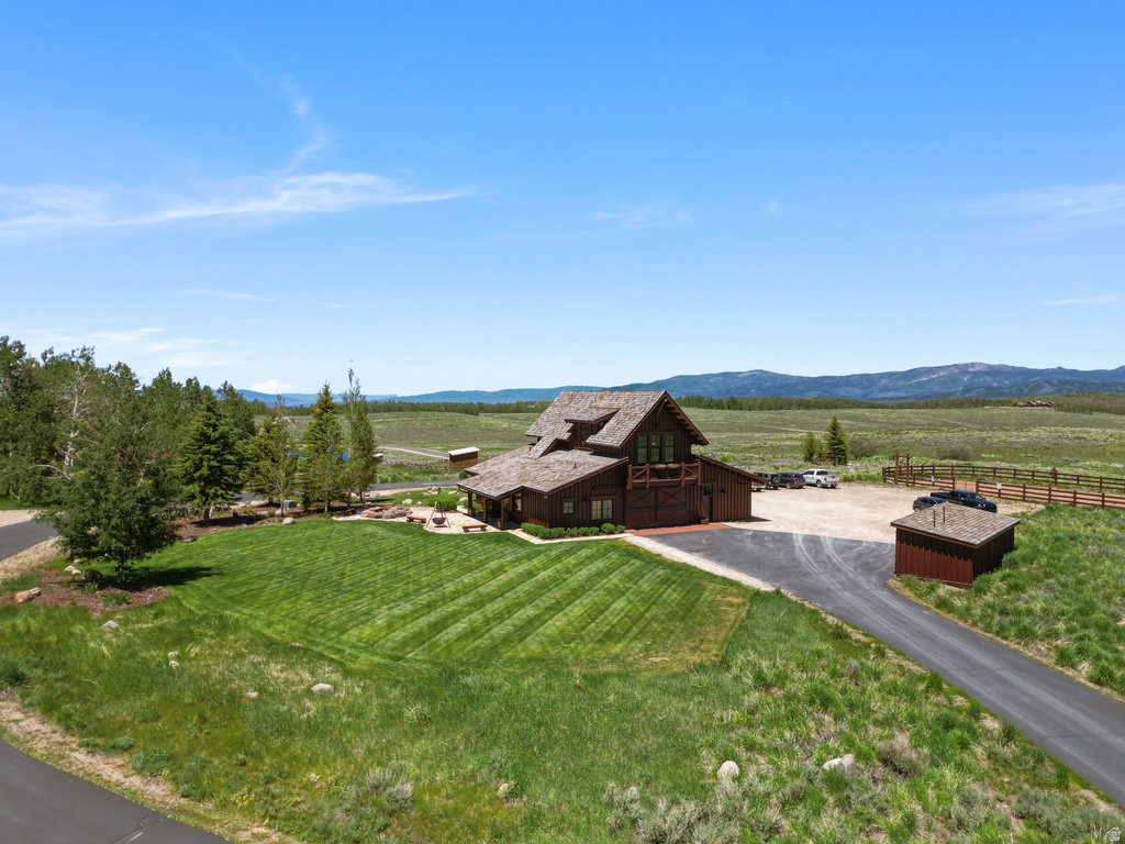 Wood-sided lodge-style residence with a cedar shake roof