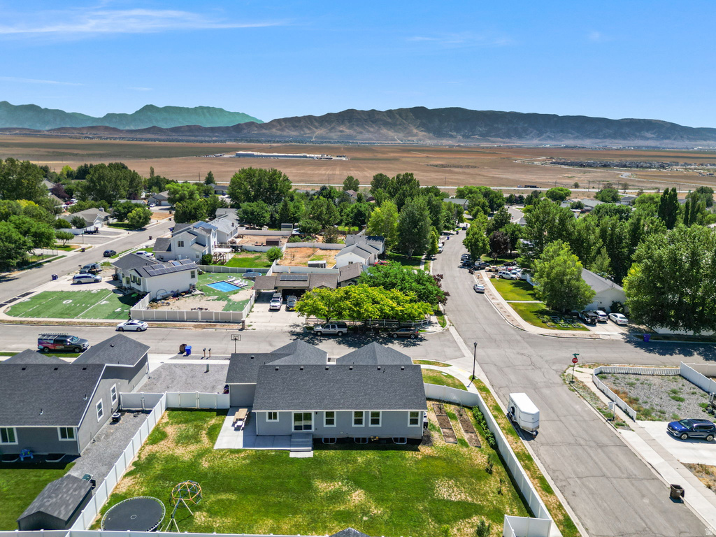 Aerial view of a residential neighborhood with distant mountains