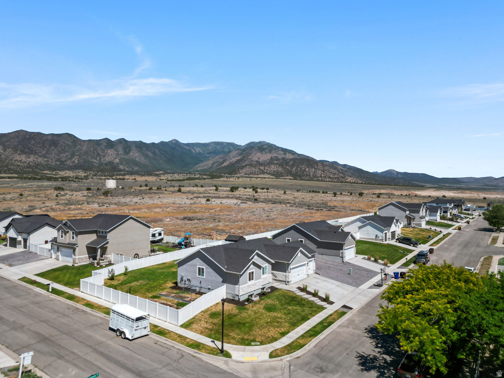 New construction homes with gray exteriors and dark roofing
