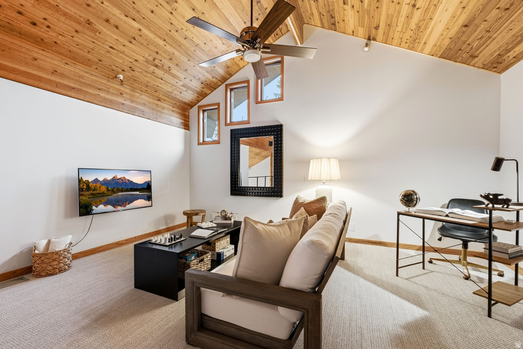 Vaulted wood-paneled ceiling with a ceiling fan