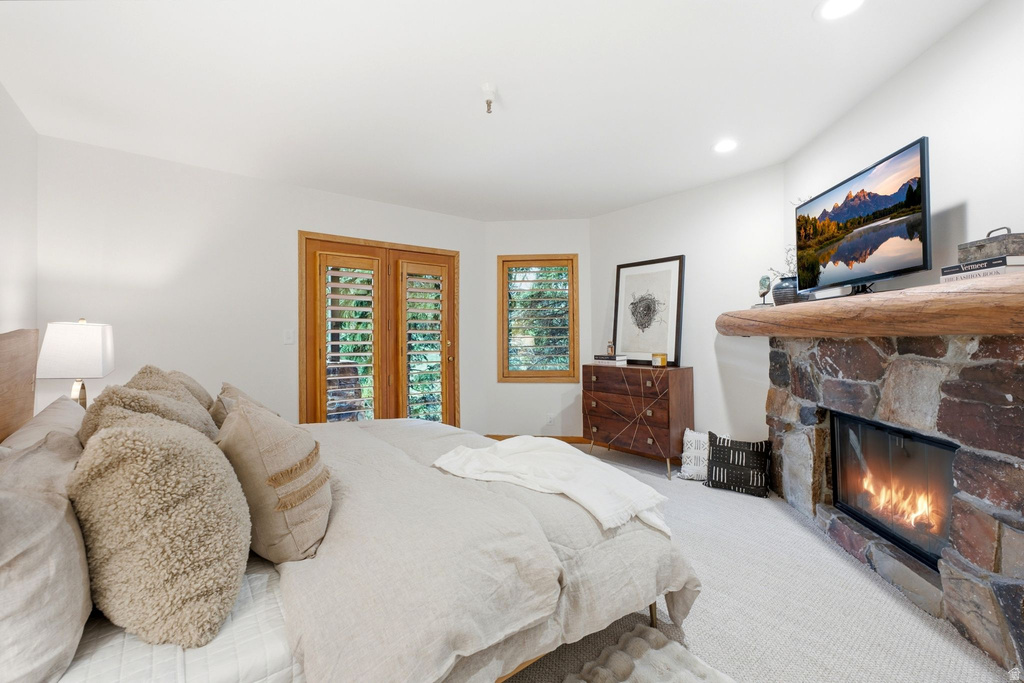 Stone fireplace with a substantial timber mantel