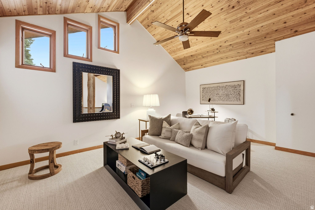 Vaulted wood-paneled ceiling with a ceiling fan