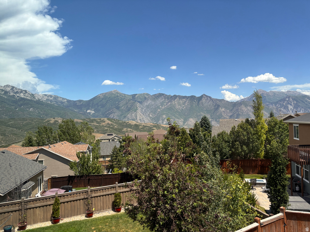 Expansive mountainous backdrop frames the suburban landscape