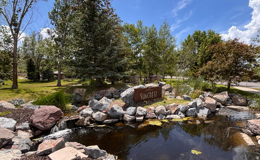 Landscaped entry feature with a pond and rockery, showcasing a \\\\\\\\
