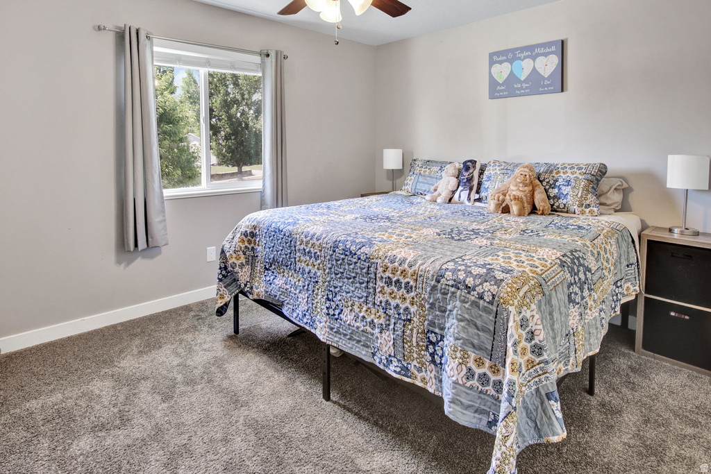 Neutral-toned walls complement the gray carpeting