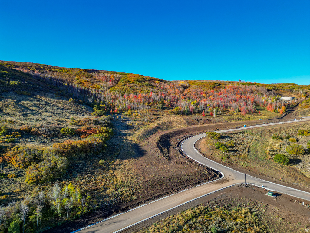 Winding paved road ascending a hillside