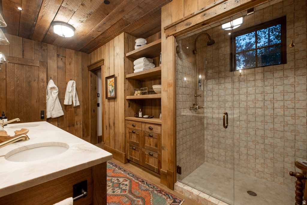 Spacious bathroom featuring a glass-enclosed shower with tiled walls and a rain showerhead