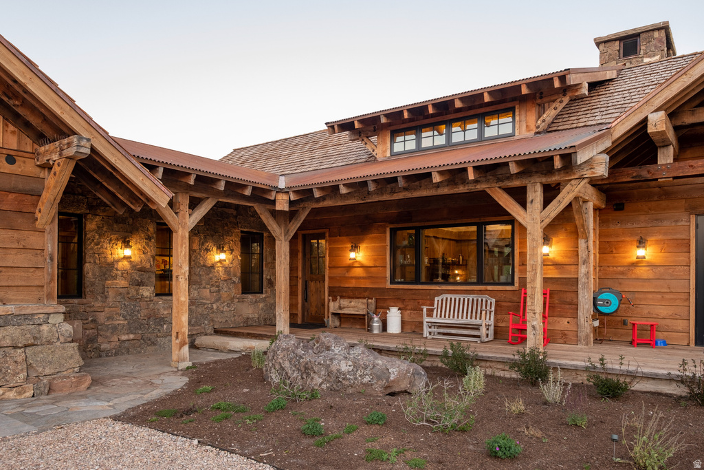 Rustic-inspired exterior featuring natural wood siding and stone veneer