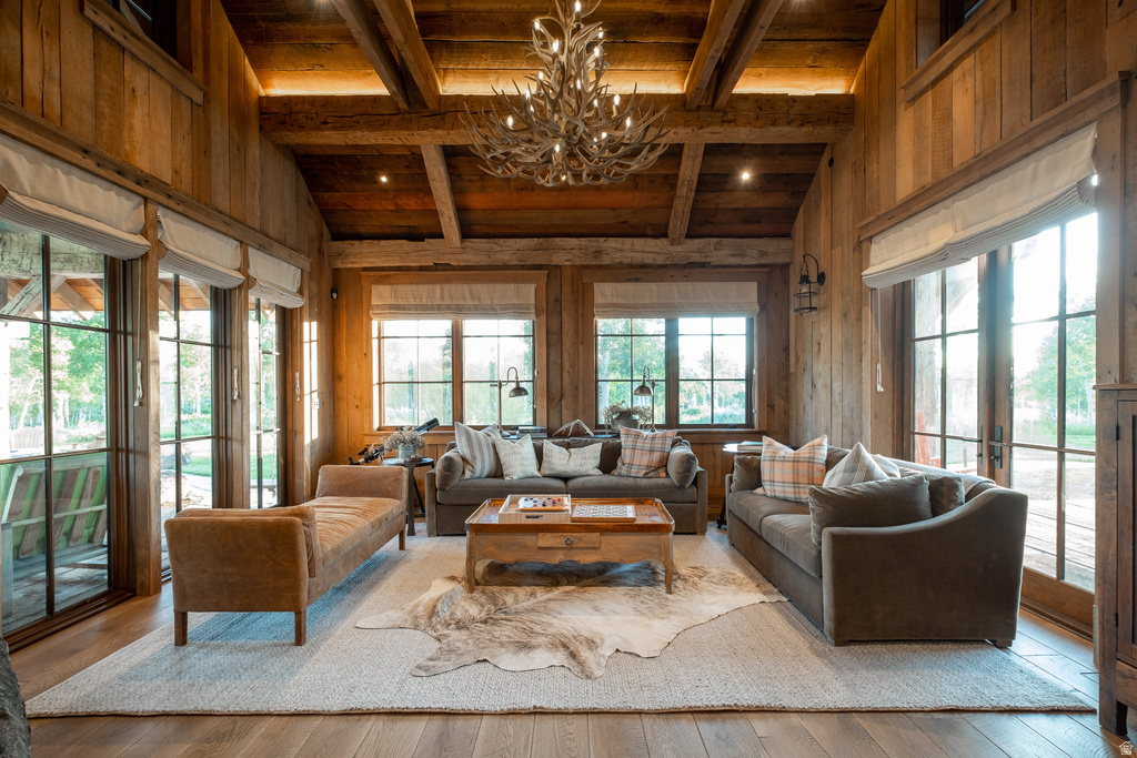 Vaulted wood-paneled ceilings with exposed beams and recessed lighting