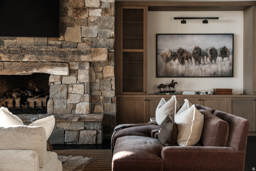 Stone-clad fireplace with a thick timber mantel