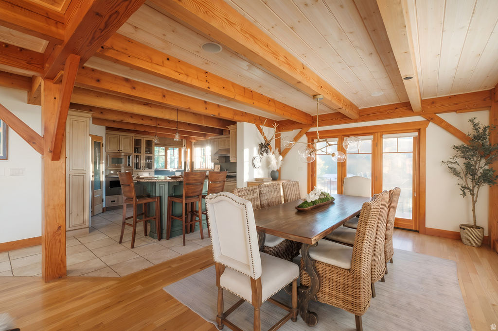 Exposed timber beams and wood-finish flooring define this inviting dining area