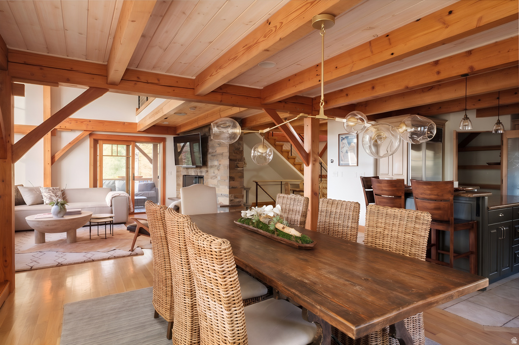 Expansive dining area featuring a custom wood dining table with woven chairs